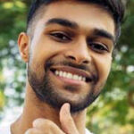 Guy thumbs up smiling